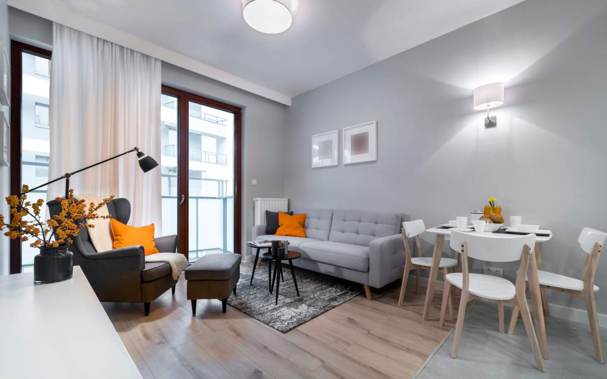 Living room  with private patio   at Clintonville Commons in North Haven, Connecticut