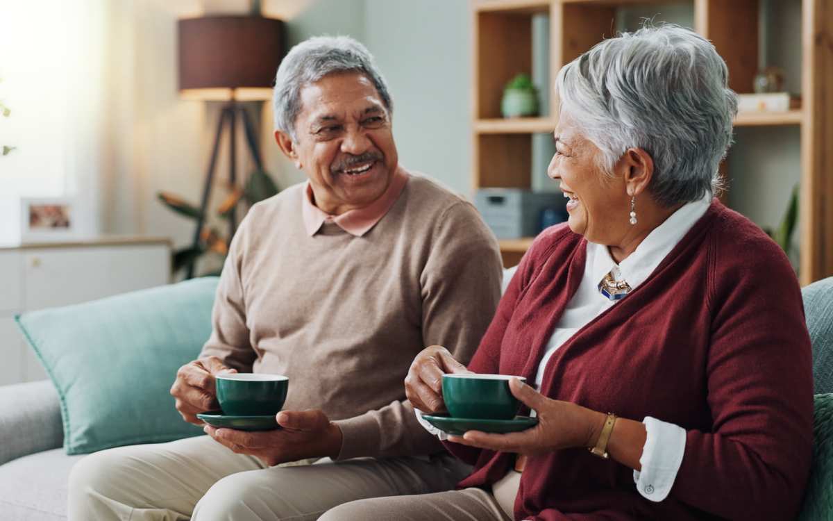 Resident couple having coffee in model apartment at Wilton Commons in Wilton, Connecticut
