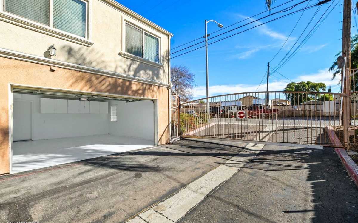 View of gate entrance and spacious garage.