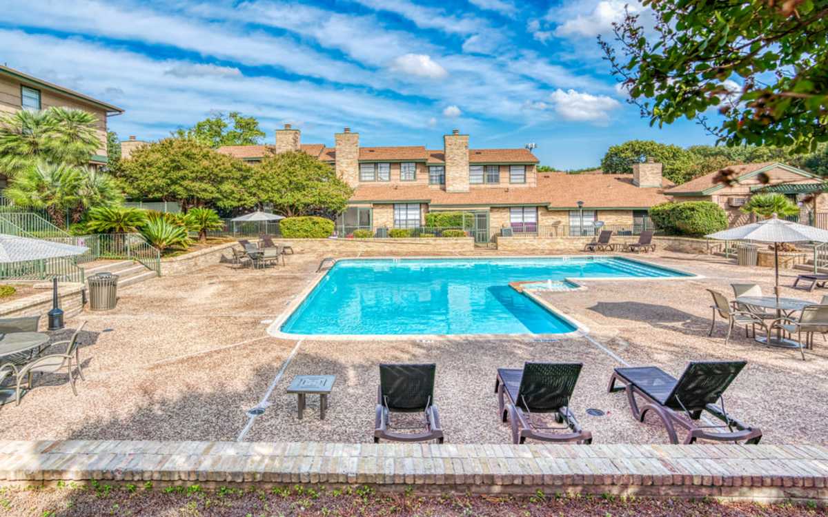 Pool area with pool chairs at Camino Real.