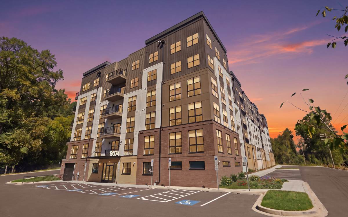 Twilight Exterior Image of the Community w/Building Entrance