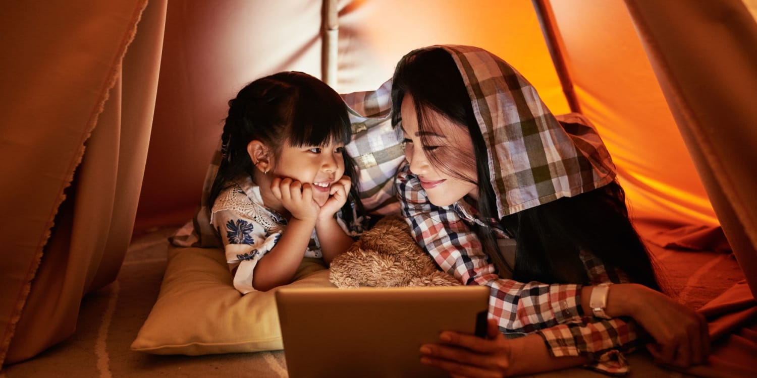 A mother and daughter looking at a tablet at Sola Westchase in Houston, Texas