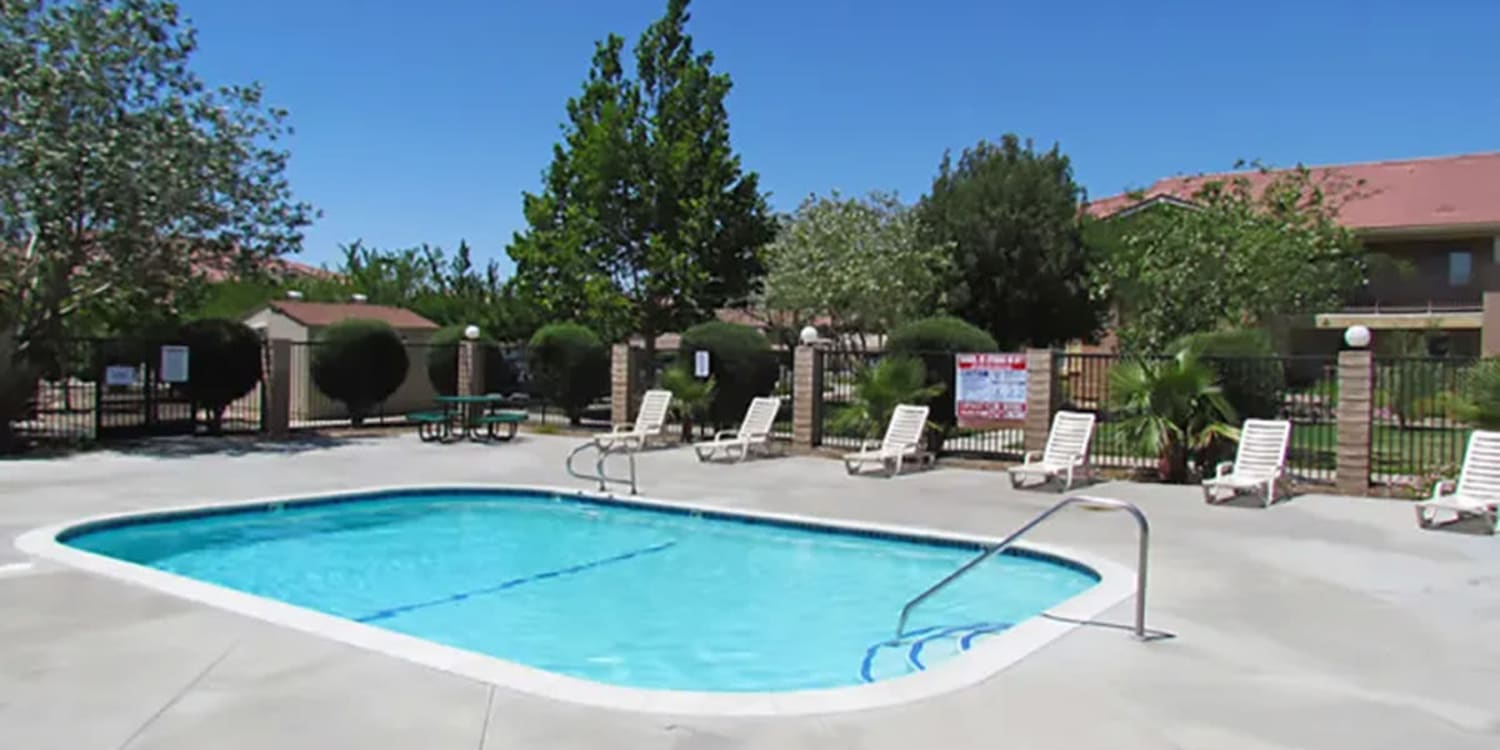 Deck chair around outdoor swimming pool at Casablanca Apartments in Palmdale, California