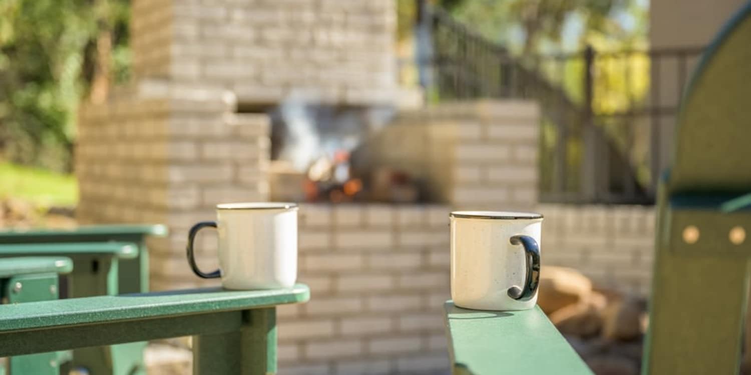 Ivy Terrace, enjoying hot coffee by fire pit. 