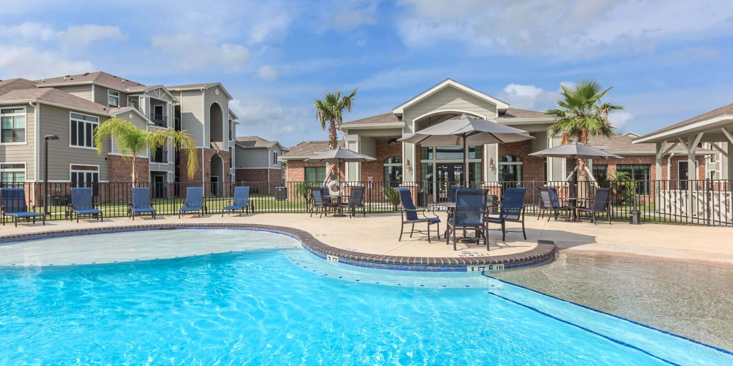 Swimming pool with lounge chairs at The Colony in Victoria, Texas