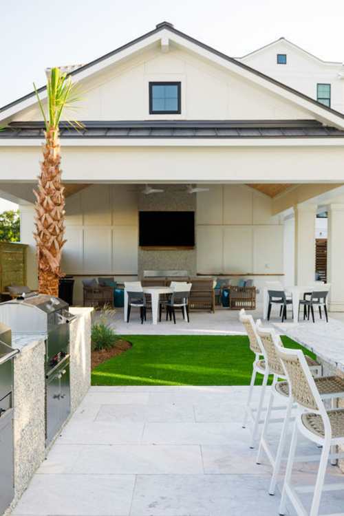 Outdoor grilling station by the pool at Proximity Carolina Beach in Carolina Beach, North Carolina
