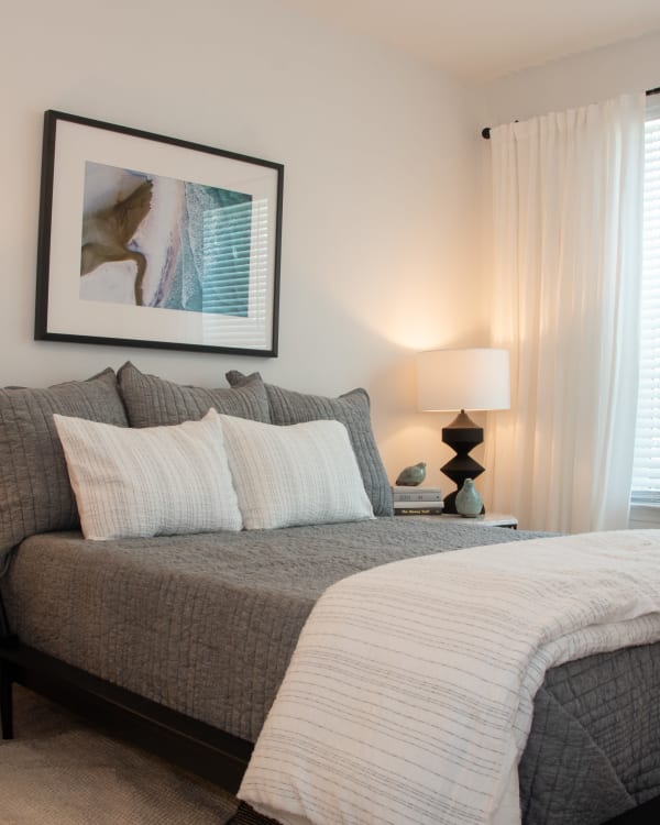 Model bedroom with plush carpeting at Primrose at Santa Rosa Beach in Santa Rosa Beach, Florida