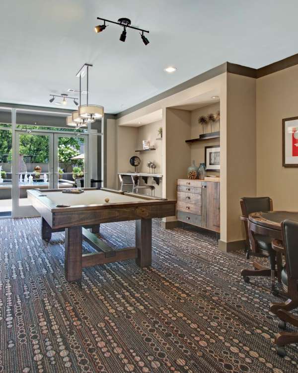 Leather sofa and eclectic lighting in the clubhouse at Note 16 in Nashville, Tennessee