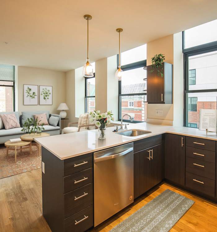 Island in a kitchen with quartz countertops at Reside MKT in Wilmington, Delaware