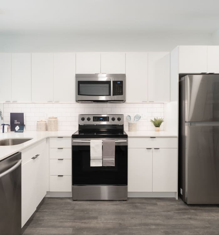 Stainless-steel appliances in an apartment kitchen at The Cooper in Wilmington, Delaware