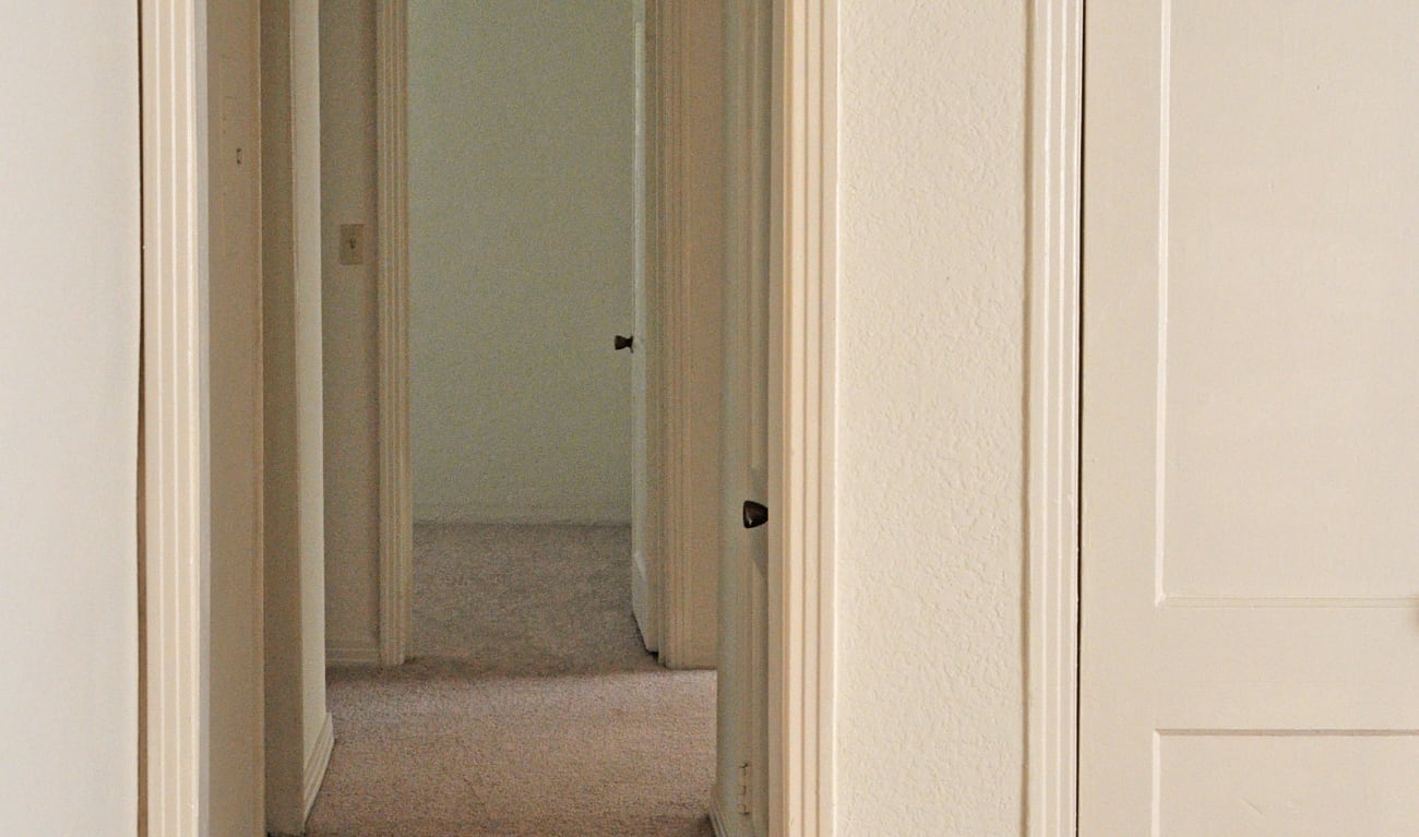 Hallway with plush carpets at St. Johns Landing Apartments in Green Cove Springs, Florida