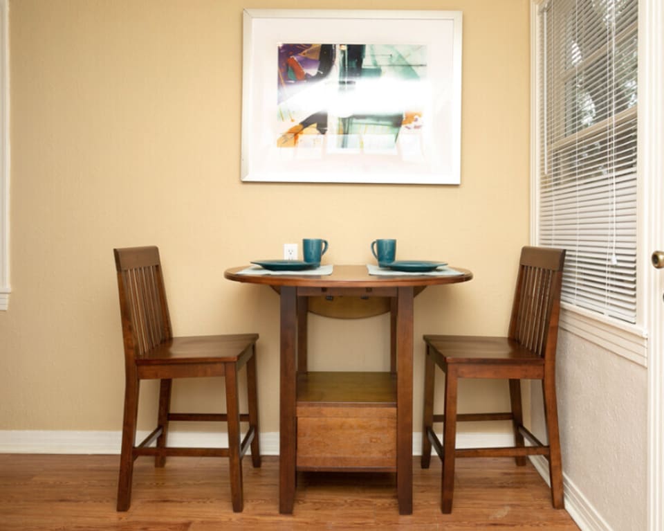 Small Dining Table With Two Chairs at St. Johns Landing Apartments in Green Cove Springs, Florida