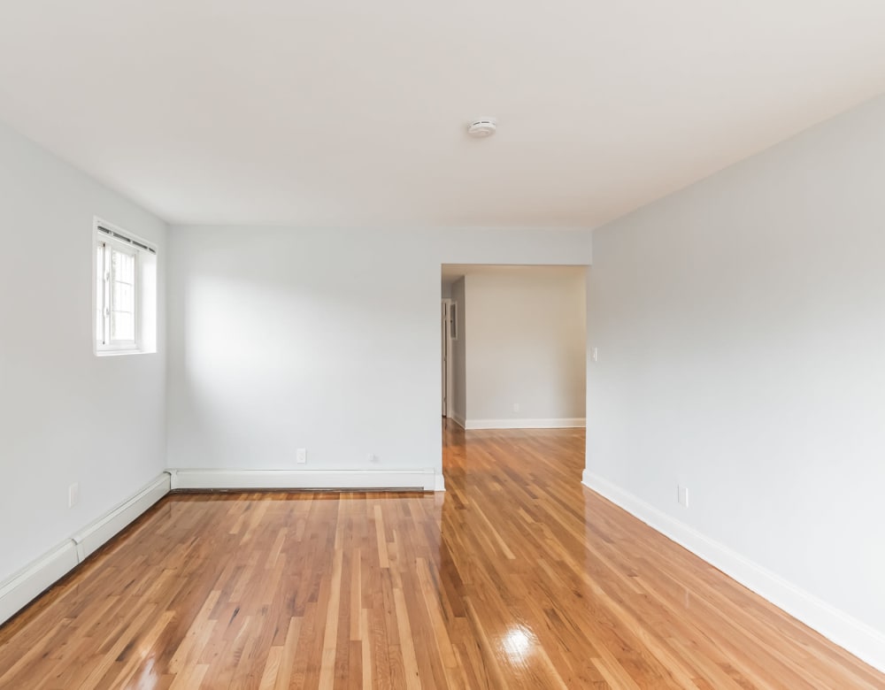 Hardwood flooring in a bright bedroom at Eagle Rock Apartments at Carle Place in Carle Place, New York