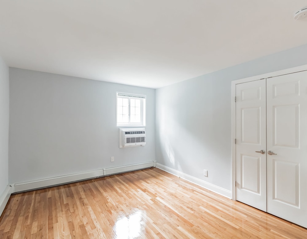 Hardwood flooring in bedroom at Eagle Rock Apartments at Carle Place in Carle Place, New York