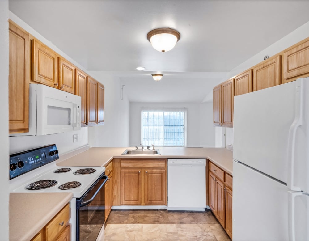 Ample cupboard space for storage in a model home's kitchen at Eagle Rock Apartments & Townhomes at Rensselaer in Rensselaer, New York