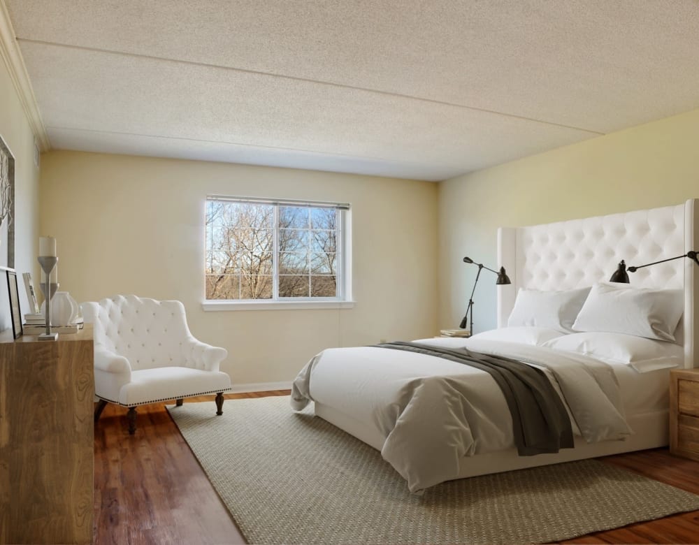 Modern bedroom with oversized headboard at Eagle Rock Apartments at Swampscott in Swampscott, Massachusetts