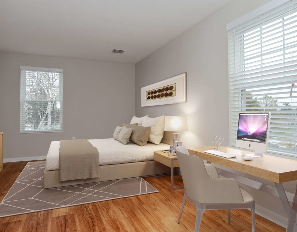 Bedroom with desk and computer at Bay Ridge at Nashua Apartments in Nashua, New Hampshire