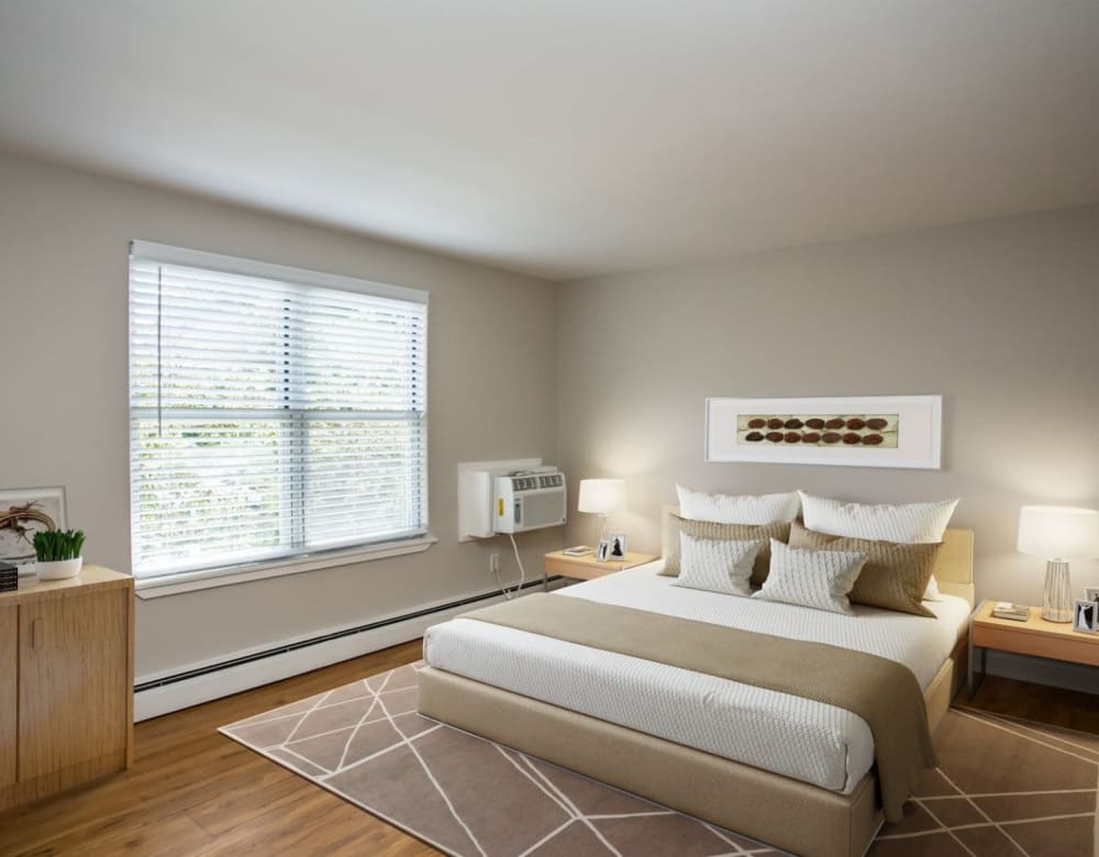Bedroom with large windows at Eagle Rock Apartments & Townhomes at Brighton in Brighton, Massachusetts