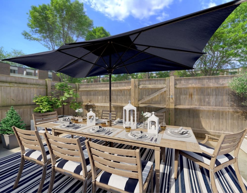 Patio with modern seating area at Eagle Rock Apartments & Townhomes at Brighton in Brighton, Massachusetts