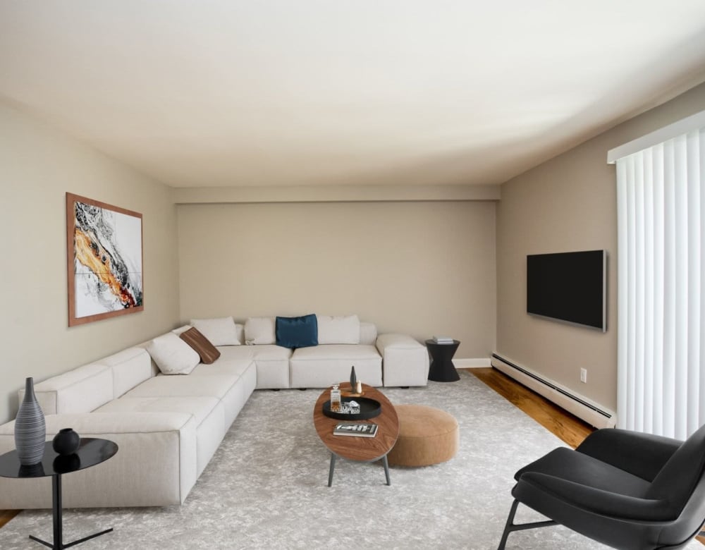 Large living room with plenty of light at Eagle Rock Apartments & Townhomes at Brighton in Brighton, Massachusetts