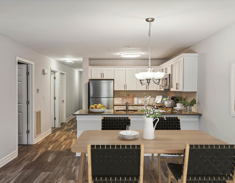 Kitchen overlooking dining area at Eagle Rock Apartments & Townhomes at Rensselaer in Rensselaer, New York