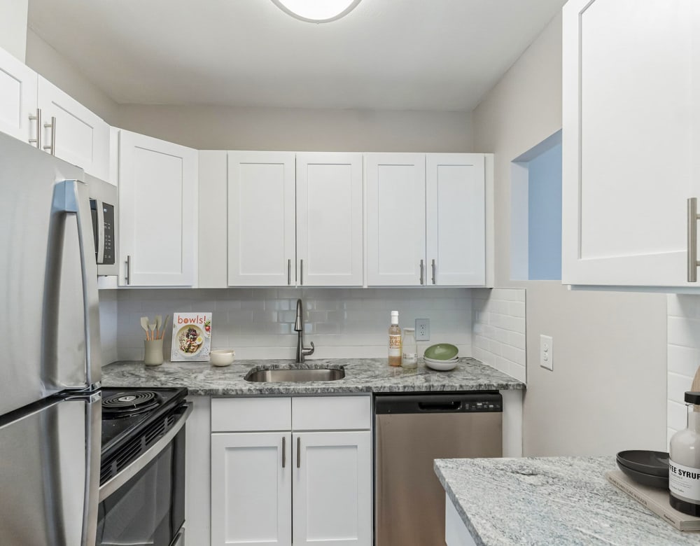Kitchen with white furnished canibets Eagle Rock Apartments at Framingham in Framingham, Massachusetts
