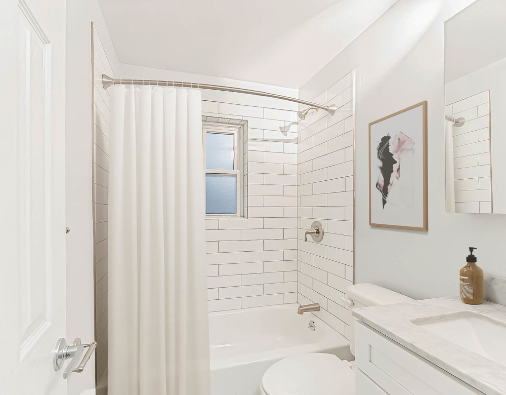 Bathroom with bathtub at Eagle Rock Apartments at Huntington Station in Huntington Station, New York