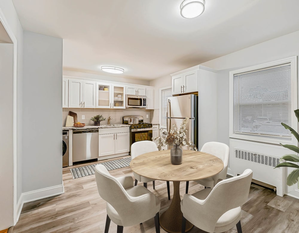 Dining area overlooking kitchen area at Eagle Rock Apartments at Huntington Station in Huntington Station, New York