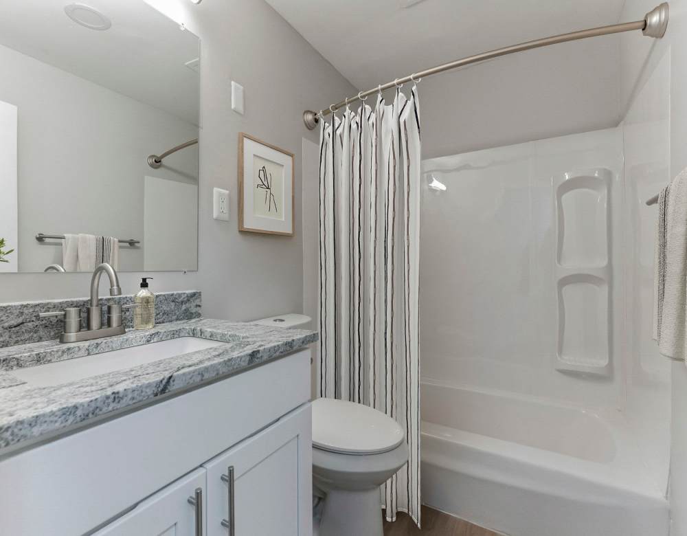 Marble bathroom at Eagle Rock Apartments at Framingham memory care in Framingham, Massachusetts