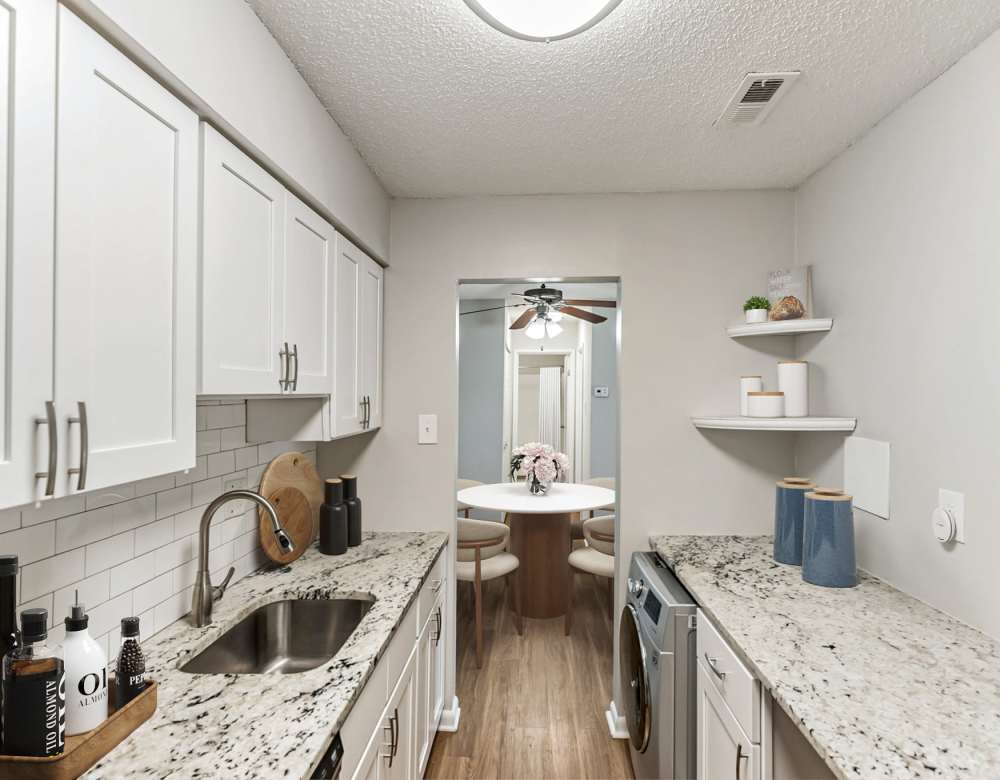 Modern kitchen with white cabinets at Ramblewood Village Apartments in Mount Laurel, New Jersey