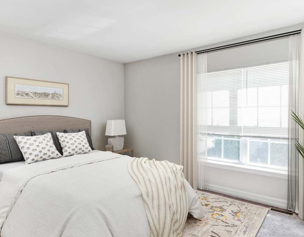 Bedroom with large windows at Eagle Rock Apartments & Townhomes at Rensselaer in Rensselaer, New York 