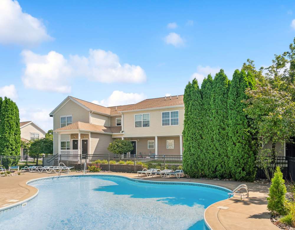 Swimming pool with pool seats at Eagle Rock Apartments & Townhomes at Rensselaer in Rensselaer, New York 