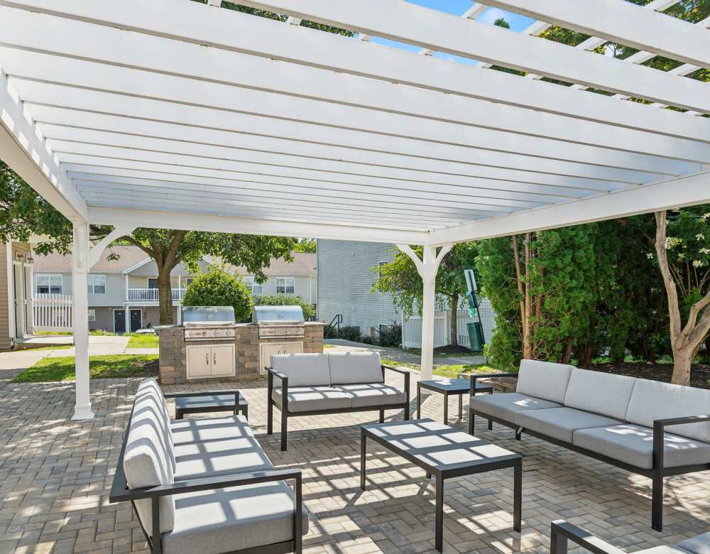 Grill and Picnic area with outdoor seating at Eagle Rock Apartments & Townhomes at Rensselaer in Rensselaer, New York 