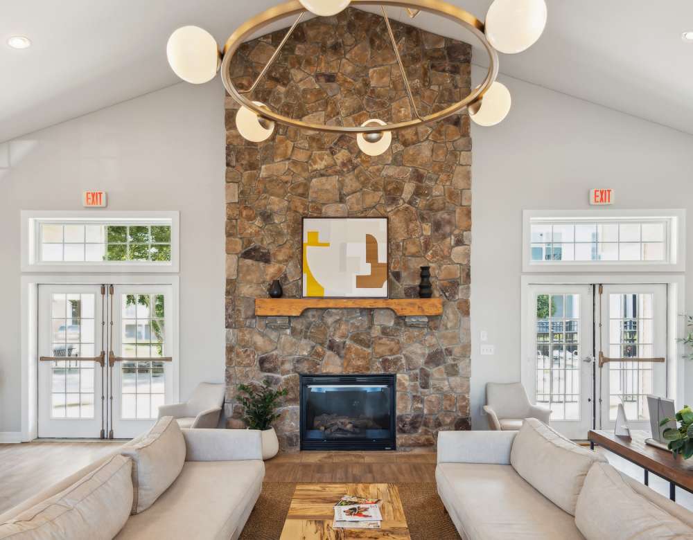 Seating area with fireplace at Eagle Rock Apartments & Townhomes at Rensselaer in Rensselaer, New York 