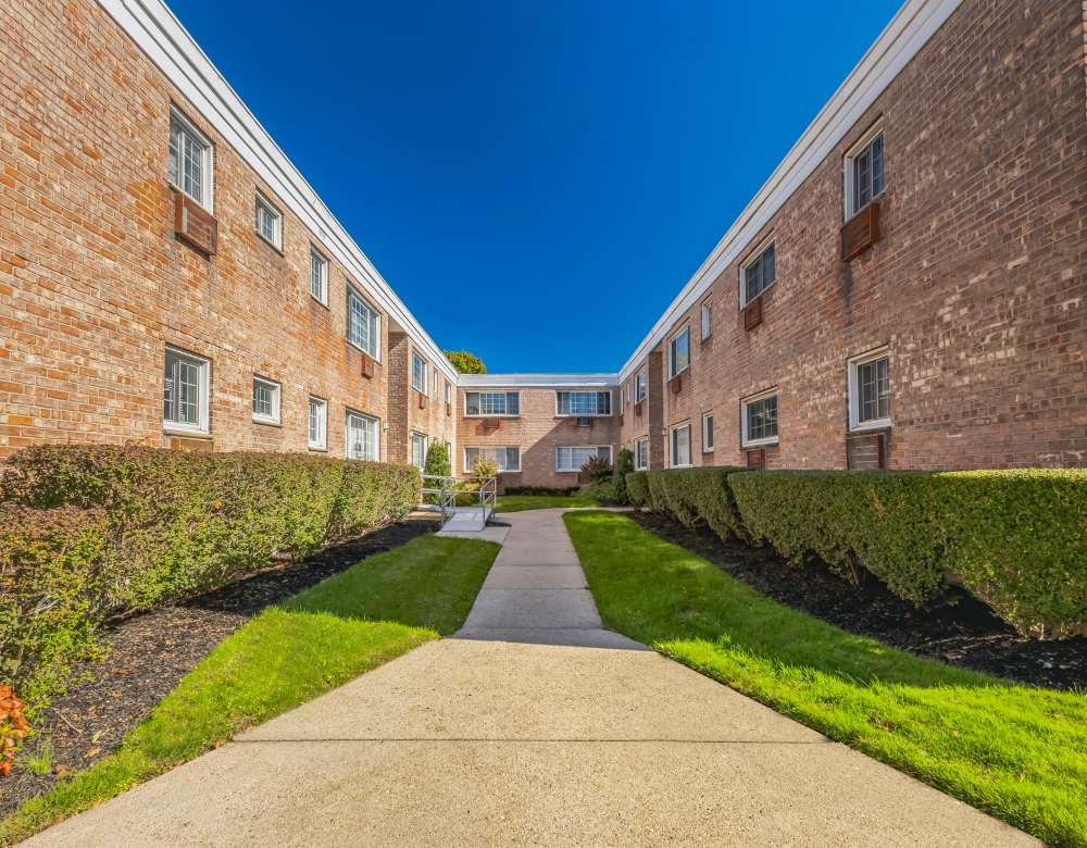 Beautifully landscaped courtyards at Eagle Rock Apartments at Carle Place in Carle Place, New York