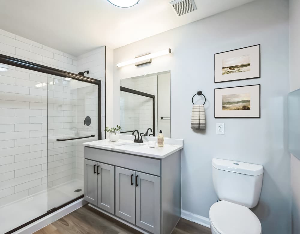 Toilet and bath at Eagle Rock Apartments at Freehold in Freehold, New Jersey