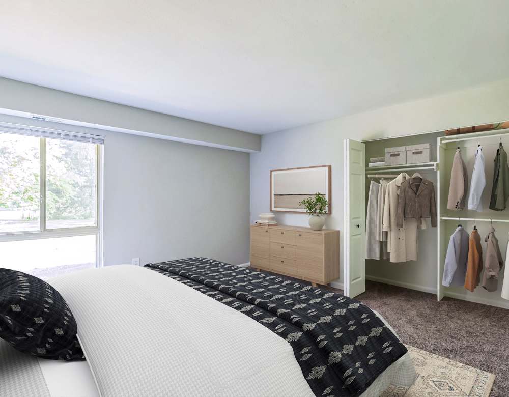 Bedroom with large window at Ramblewood Village Apartments in Mount Laurel, New Jersey
