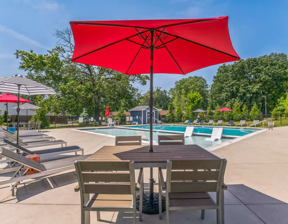 Seating area outside of the pool at Ramblewood Village Apartments in Mount Laurel, New Jersey
