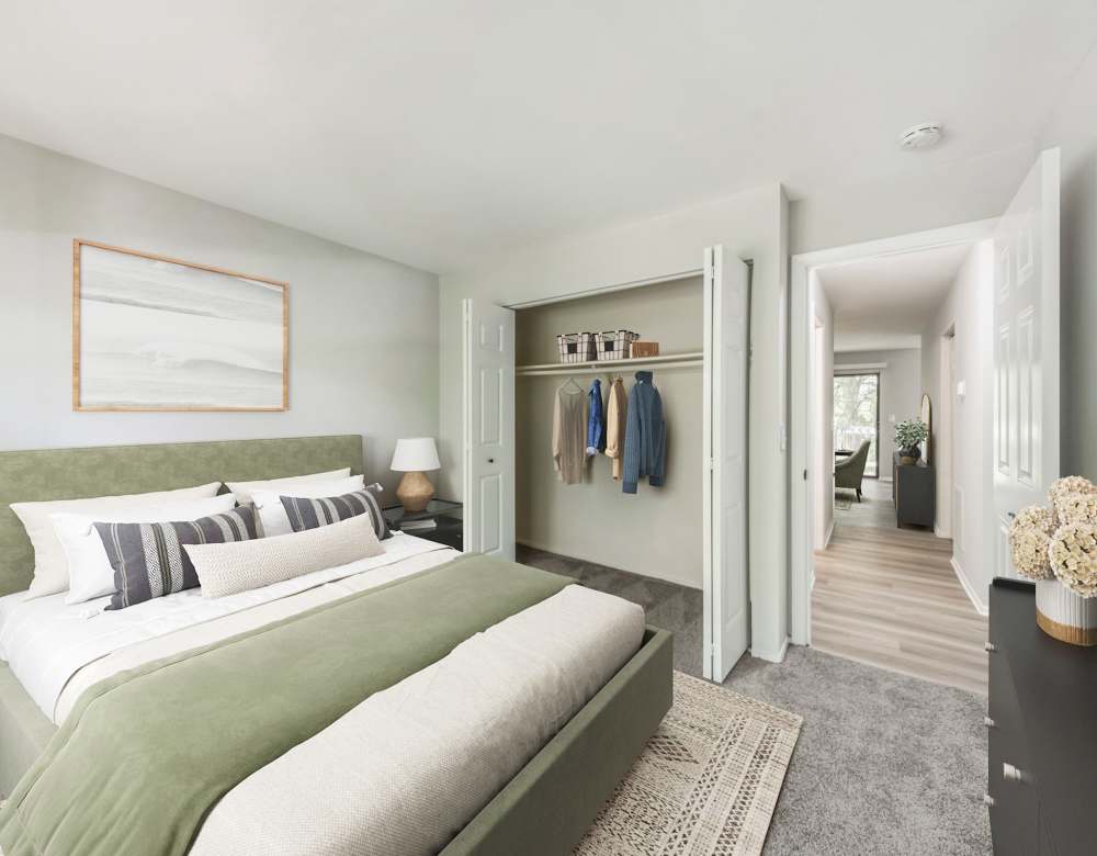 Carpeted Bedroom with Wooden Headboard and Dresser at Eagle Rock Apartments at Columbia in Columbia, Maryland
