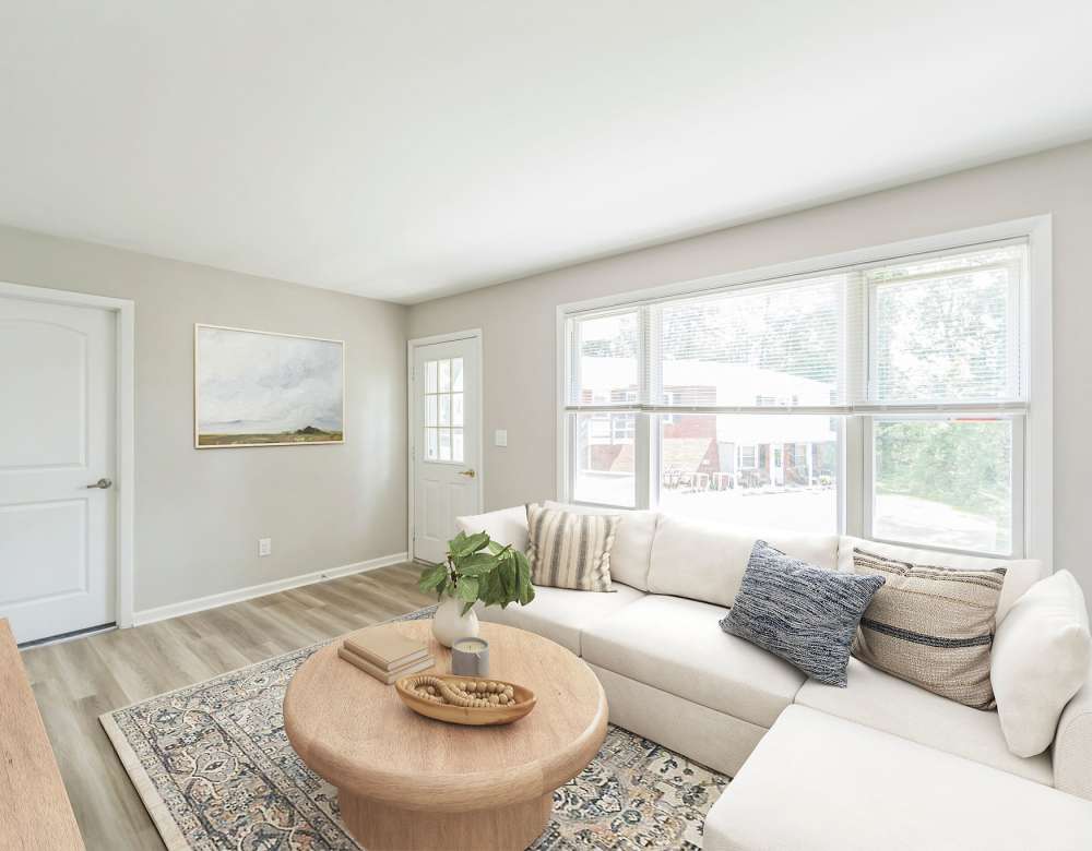 Dining area with view of the living room at Northway Eleven, An Eagle Rock Community in Ballston Lake, New York