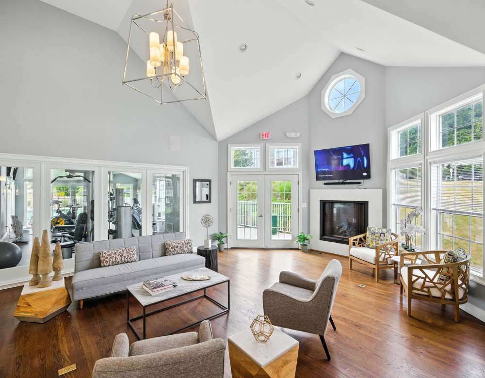 A modern, well-lit basement recreation room at Summit at Mill Ridge