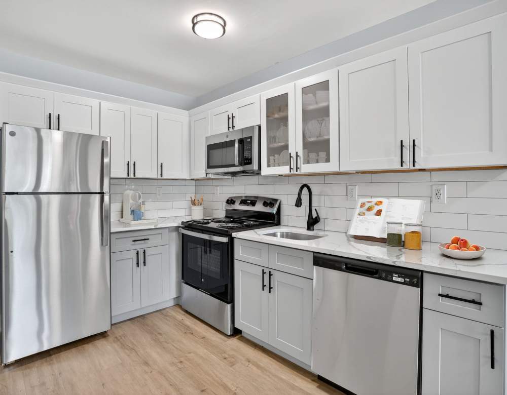 Bunt Commons II offers a renovated kitchen with two-tone cabinets in Copiague, New York