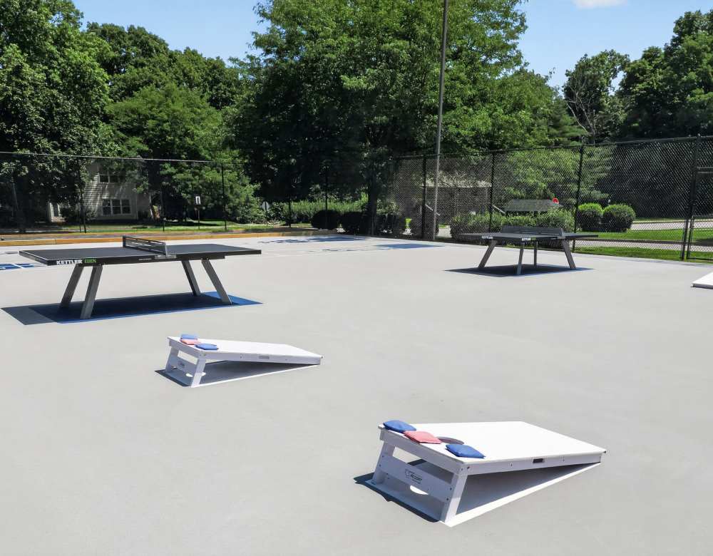 Table tennis and corn hole at Vista Point Apartments in Wappingers Falls, New York
