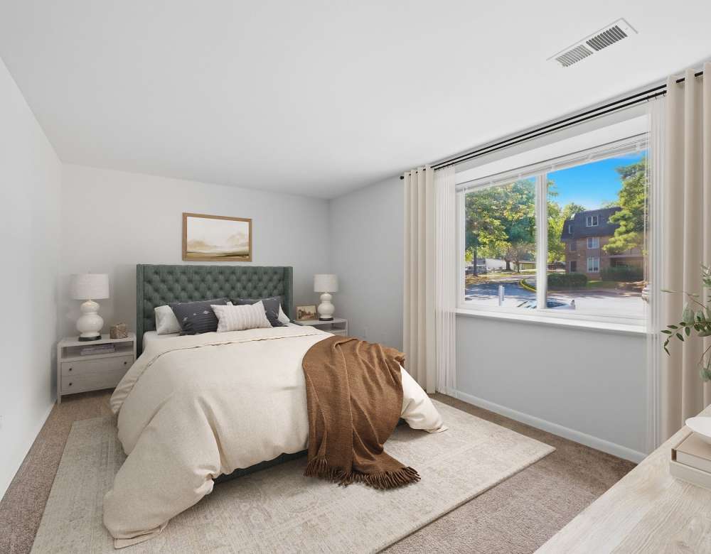 Spacious bedroom with natural light at Fairway Apartments in Reston, Virginia