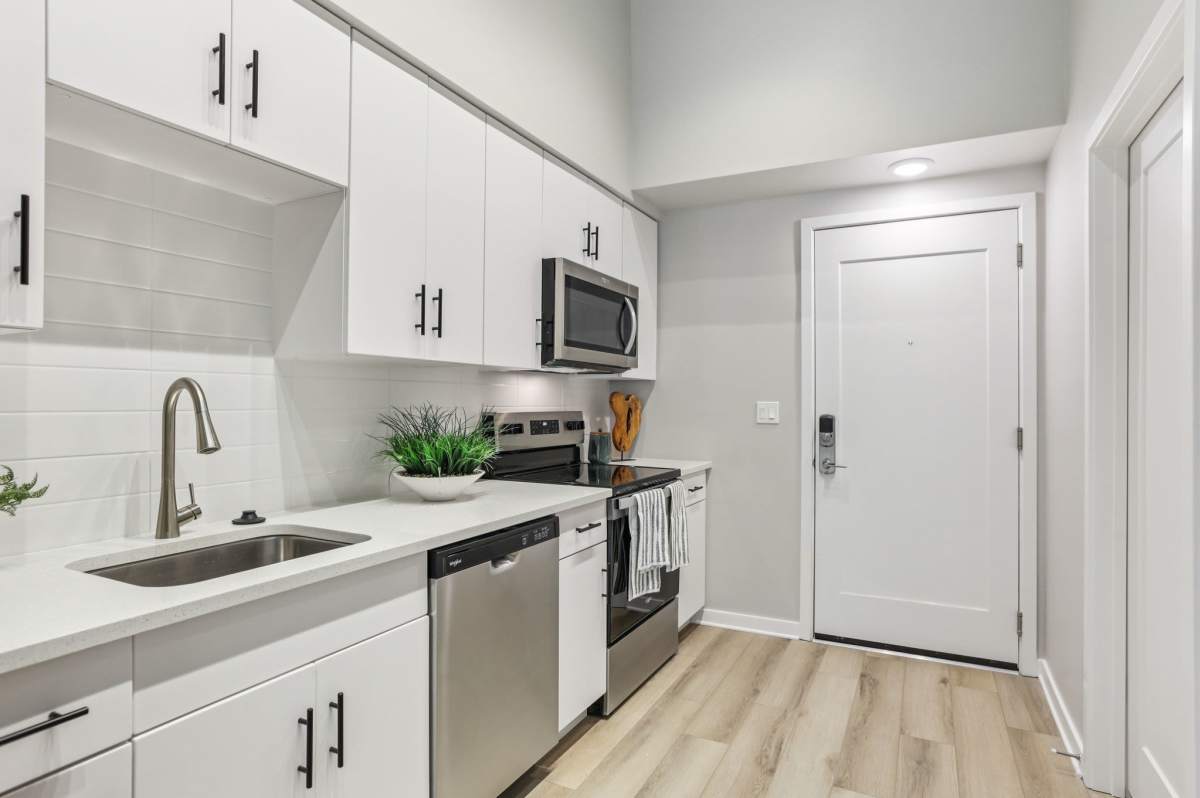 Kitchewn with wooden flooring at The Breeze in Winter Haven, Florida