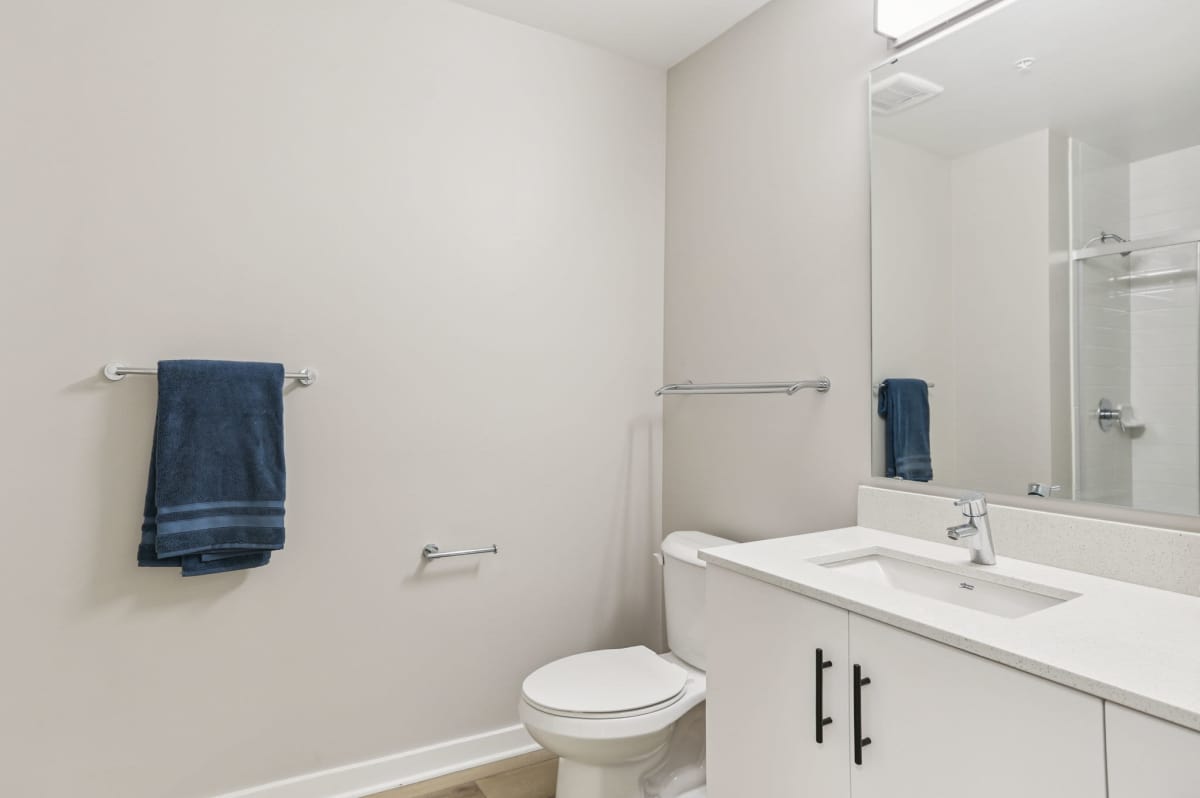 Bathroom with wooden flooring at The Breeze in Winter Haven, Florida