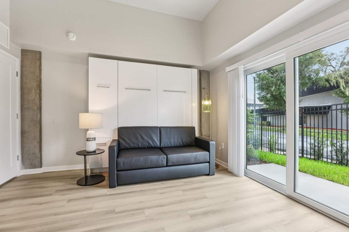 Living room with attached patio at The Breeze in Winter Haven, Florida