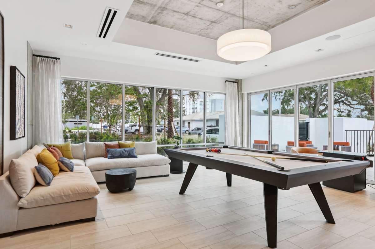 Pool table and seating area at The Breeze in Winter Haven, Florida