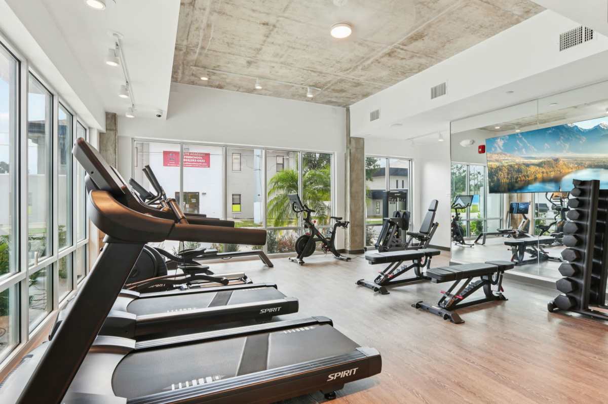 Fitness center with wooden flooring at The Breeze in Winter Haven, Florida