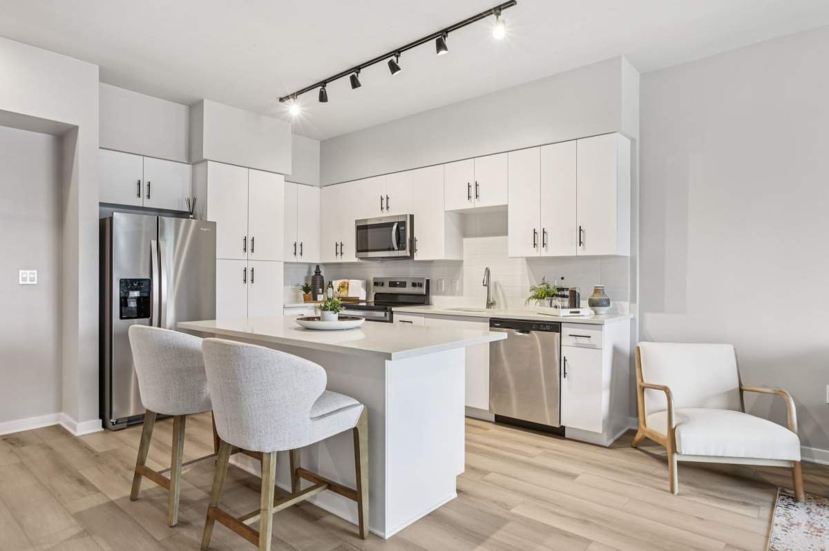 Kitchen with ceiling track light at The Breeze in Winter Haven, Florida